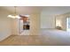 Open-concept living space with carpet and combined kitchen and living areas at 1800 Clairmont Lk # 213, Decatur, GA 30033
