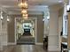 Elegant lobby featuring decorative columns, tiled floors, and a fireplace in the background at 1800 Clairmont Lk # 213, Decatur, GA 30033