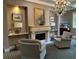Inviting lounge area with cozy seating, fireplace, and elegant chandelier lighting at 1800 Clairmont Lk # 213, Decatur, GA 30033