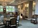 Cozy lounge area with comfortable seating, fireplace, built-in shelving, and chandelier lighting at 1800 Clairmont Lk # 213, Decatur, GA 30033
