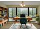 Bright office features a large window, a desk, and built-in shelving, ideal for productivity at 1800 Clairmont Lk # 213, Decatur, GA 30033