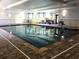Indoor swimming pool area with tile flooring and ample natural light at 1800 Clairmont Lk # 213, Decatur, GA 30033