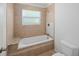 Bathroom featuring a tile shower and bathtub with a granite countertop at 24 Dunwoody Springs Dr, Atlanta, GA 30328