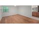 A spacious bedroom with hardwood floors and a window letting in plenty of natural light at 24 Dunwoody Springs Dr, Atlanta, GA 30328