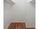 Empty walk-in closet with hardwood floors and shelves at 24 Dunwoody Springs Dr, Atlanta, GA 30328