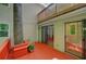 Outdoor deck featuring a tree, red-stained wood, and sliding door access to the house at 24 Dunwoody Springs Dr, Atlanta, GA 30328