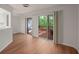 Bright dining area features wood floors and glass doors leading to the outdoor deck at 24 Dunwoody Springs Dr, Atlanta, GA 30328