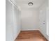 Inviting foyer with wood-look floors, a closet, and a glass-paneled front door for natural light at 24 Dunwoody Springs Dr, Atlanta, GA 30328