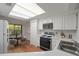Bright, updated kitchen with modern appliances and eat-in area at 24 Dunwoody Springs Dr, Atlanta, GA 30328