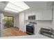 Bright, updated kitchen with modern appliances and eat-in area at 24 Dunwoody Springs Dr, Atlanta, GA 30328