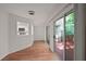 Living room featuring wood floors, a sliding glass door, and a view into the kitchen at 24 Dunwoody Springs Dr, Atlanta, GA 30328