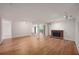 Spacious living room with fireplace, wood flooring, and an open layout for entertaining at 24 Dunwoody Springs Dr, Atlanta, GA 30328