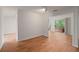 Bright living area with wood floors, access to outdoor deck, and neutral decor for versatile styling at 24 Dunwoody Springs Dr, Atlanta, GA 30328