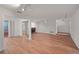 Open-concept living room with wood flooring, sliding glass doors to deck, and lots of natural light at 24 Dunwoody Springs Dr, Atlanta, GA 30328
