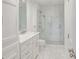 The bathroom features a marble countertop vanity, a seamless glass shower, and white tile at 300 Johnson Ferry Ne Rd # A706, Atlanta, GA 30328