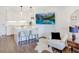 Open-concept living area and kitchen create inviting atmosphere with modern decor and an entertainment center at 300 Johnson Ferry Ne Rd # A706, Atlanta, GA 30328
