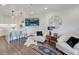 Inviting living area with modern furnishings adjacent to kitchen, creating a cohesive and stylish living space at 300 Johnson Ferry Ne Rd # A706, Atlanta, GA 30328