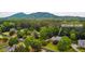Aerial view of a home surrounded by lush greenery, showcasing the property's spacious lot and natural setting at 680 Parkside Trl, Marietta, GA 30064