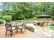 Beautiful backyard featuring a pool, patio seating, and lush greenery perfect for outdoor entertaining at 680 Parkside Trl, Marietta, GA 30064