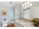 Charming bathroom featuring floral wallpaper, a granite vanity, and a large mirror at 680 Parkside Trl, Marietta, GA 30064
