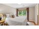 Calm bedroom with a comfy bed, soft lighting, and a window with view to the outdoors at 680 Parkside Trl, Marietta, GA 30064