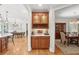 Wet bar and butler's pantry featuring custom wooden cabinets with glass doors and countertop at 680 Parkside Trl, Marietta, GA 30064