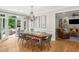 Elegant dining room features hardwood floors, chandelier, and access to outdoor seating area through french doors at 680 Parkside Trl, Marietta, GA 30064