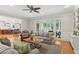 Open-concept living room with views of the kitchen and access to the outdoor living area at 680 Parkside Trl, Marietta, GA 30064