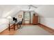Finished attic space designed as an office with hardwood floors and natural light from a dormer window at 680 Parkside Trl, Marietta, GA 30064