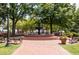 Picturesque town square with a fountain, benches, and landscaping creating a peaceful atmosphere at 680 Parkside Trl, Marietta, GA 30064