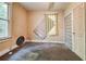 A bedroom needing repair with a window and a door with textured glass panels at , Atlanta, GA 30310