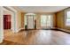 Bright living room with hardwood floors, large windows, and an open doorway leading to another room at , Atlanta, GA 30310