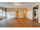 Spacious living room with original hardwood floors, arched doorways, and wainscoting detail at , Atlanta, GA 30310