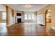 Bright living room featuring hardwood floors, fireplace, built-in shelving, and large windows at , Atlanta, GA 30310