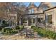 Beautiful backyard featuring manicured landscape and a stone patio with an outdoor dining set at 1031 Eulalia Ne Rd, Atlanta, GA 30319