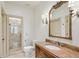 Elegant bathroom with a marble countertop, ornate mirror, and glass-enclosed shower at 1031 Eulalia Ne Rd, Atlanta, GA 30319
