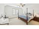 Comfortable bedroom with four-poster bed, plush bedding, and ample natural light from the window at 1031 Eulalia Ne Rd, Atlanta, GA 30319