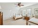 Traditional-style bedroom featuring twin beds, neutral carpet, and a ceiling fan for comfort at 1031 Eulalia Ne Rd, Atlanta, GA 30319