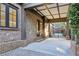 Spacious outdoor covered porch made from brick and an iron gate in the backyard at 1031 Eulalia Ne Rd, Atlanta, GA 30319