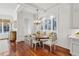 Dining area with hardwood floors, custom seating, and a large window with shutters at 1031 Eulalia Ne Rd, Atlanta, GA 30319