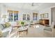 Sunlit living room with neutral decor and a view of the lush outdoors at 1031 Eulalia Ne Rd, Atlanta, GA 30319