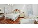 Cozy main bedroom with hardwood floors, sitting area, and abundant natural light at 1031 Eulalia Ne Rd, Atlanta, GA 30319