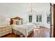 Serene main bedroom with hardwood floors, chandelier, and ample natural light at 1031 Eulalia Ne Rd, Atlanta, GA 30319
