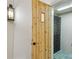 View of a door to a wine cellar with racks for bottle storage, and a light fixture at 1031 Eulalia Ne Rd, Atlanta, GA 30319