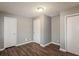Bedroom with hardwood floors, natural light, and a neutral color scheme; light gray walls at 2235 Azalea Dr, Loganville, GA 30052