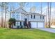 Charming two-story home featuring a two-car garage and a well-maintained lawn at 2235 Azalea Dr, Loganville, GA 30052