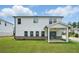 Expansive backyard showcasing a well-maintained lawn and a covered patio at 4477 Bethany Manor Dr, Snellville, GA 30039