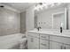 Modern bathroom featuring a double vanity, bathtub, and stylish tile work at 4477 Bethany Manor Dr, Snellville, GA 30039