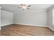 Bright bedroom features beautiful wood-look floors, crown molding and great natural light at 4477 Bethany Manor Dr, Snellville, GA 30039
