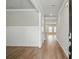 Bright entryway featuring hardwood floors, white trim, and neutral paint, leading into the home's living spaces at 4477 Bethany Manor Dr, Snellville, GA 30039